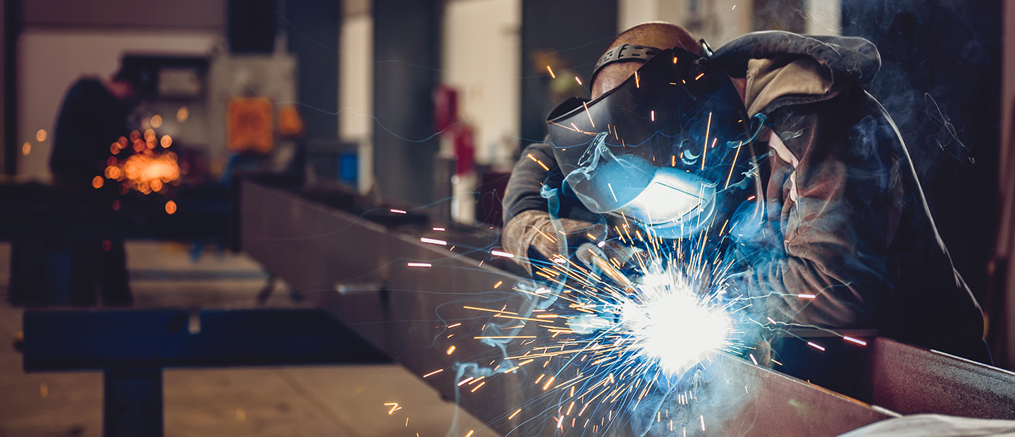 welder welding an ibeam